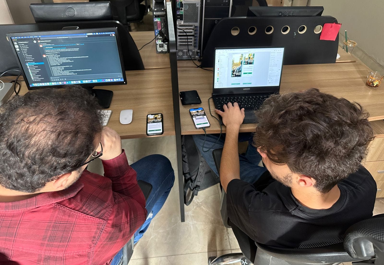 Hisham, the mobile developer, and me working on Wfrah in the same room